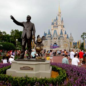 File print of visitors walking on Main Street during Walt Disney World on Jun 5, 2012, in Lake Buena Vista, Fla. (© John Raoux/AP)