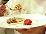 French cook Daniel Boulud shows off one of his specialties in a kitchen during his flagship restaurant, Daniel, in New York