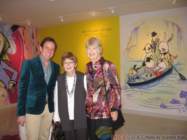 Kevin and Jeanne Chamberlain, and Maggie Richardson with a ARt of CAmille Rose Garcia covering a wall.