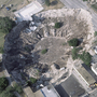 In a open of 1981, a woman's residence and partial of a automobile dealership were swallowed by a sinkhole in Winter Park, Fla.